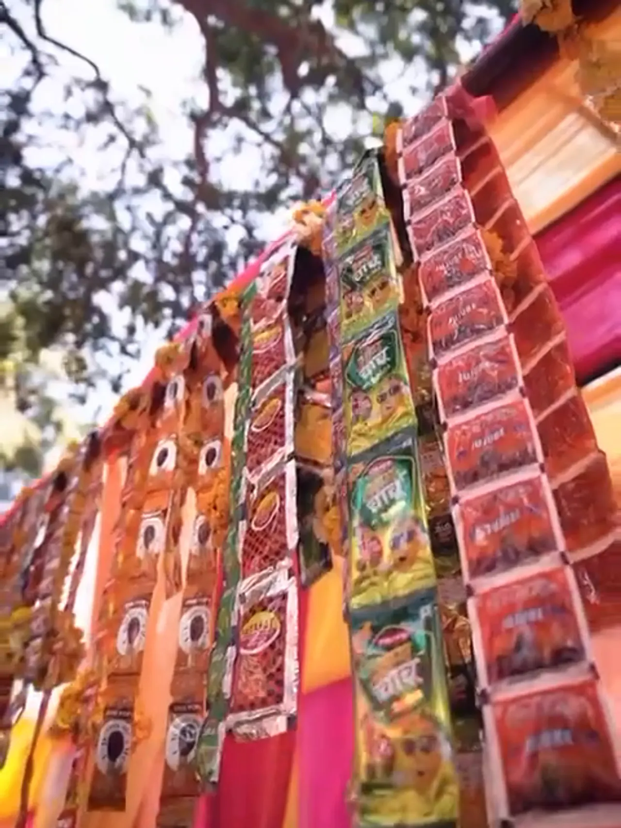 Strips of packaged retro candy hanging along the candy bar stall
